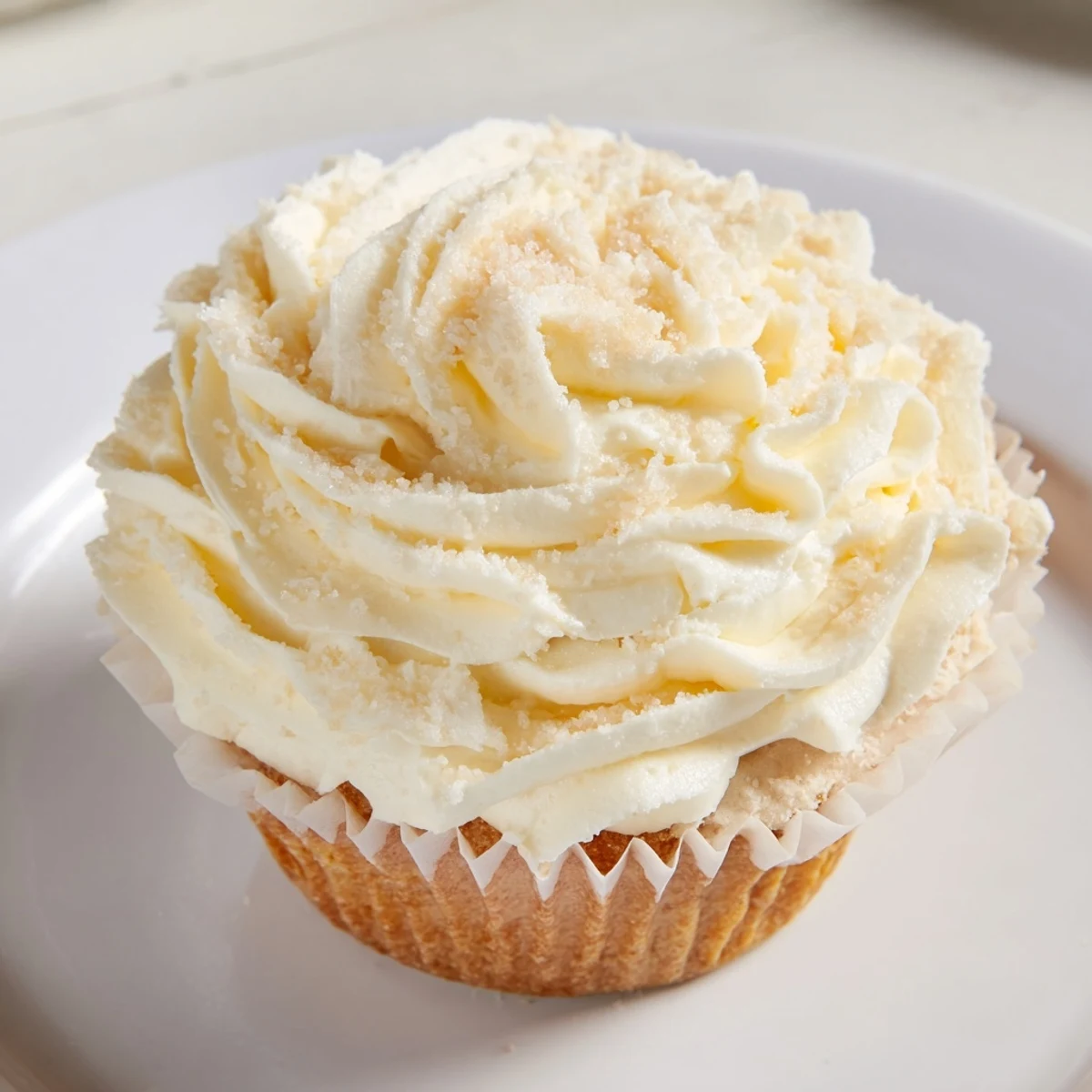Fluffy vanilla cupcakes with buttercream frosting, a classic dessert with perfect swirls.