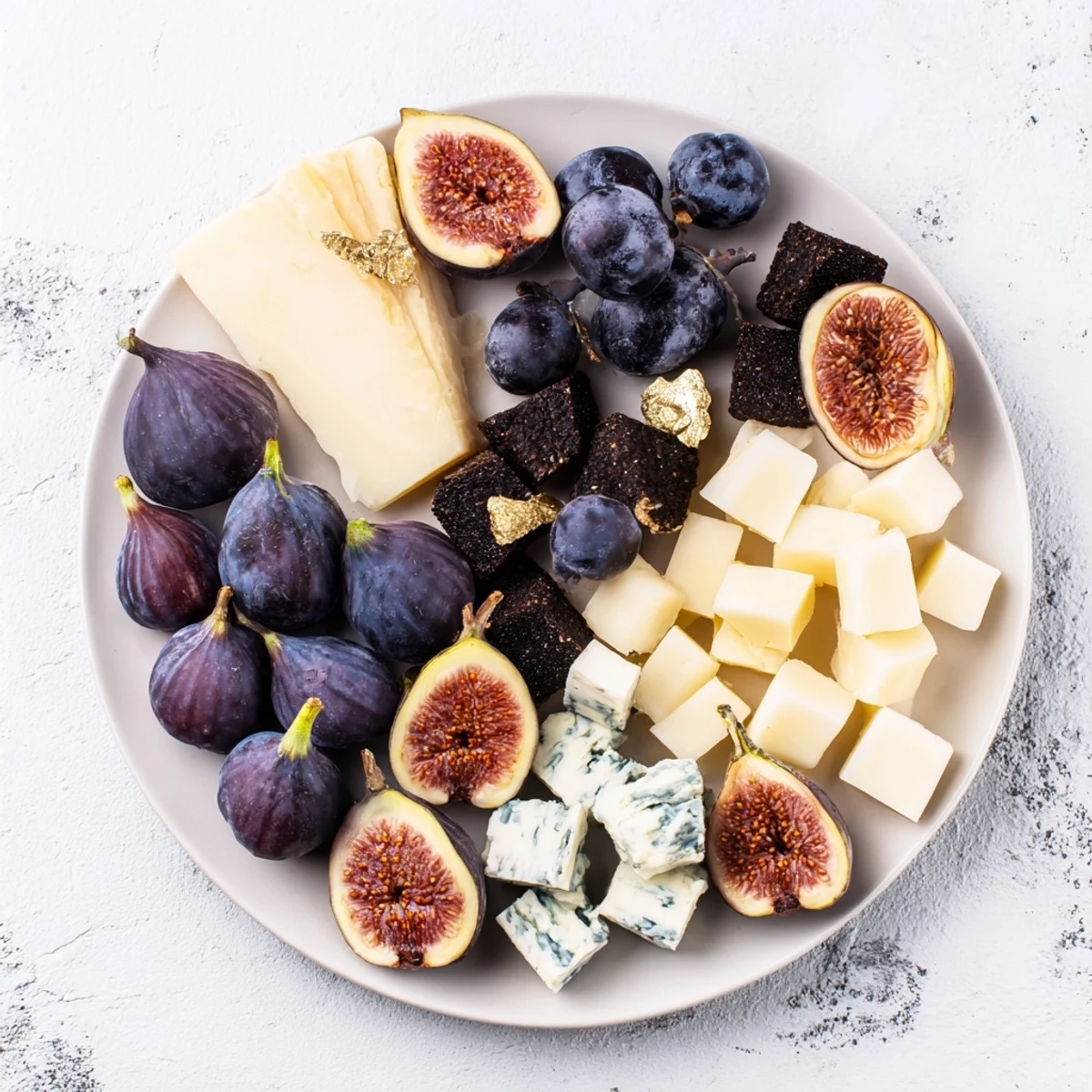 A Deep Indigo Midnight Sky cheese board with blackberries, figs, and creamy cheese stars.