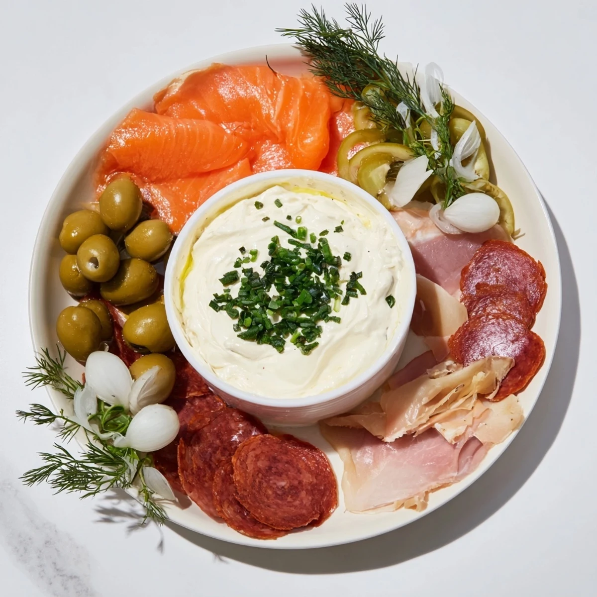 Visually stunning Compass Rose appetizer platter showing four meats radiating from a creamy dip center.