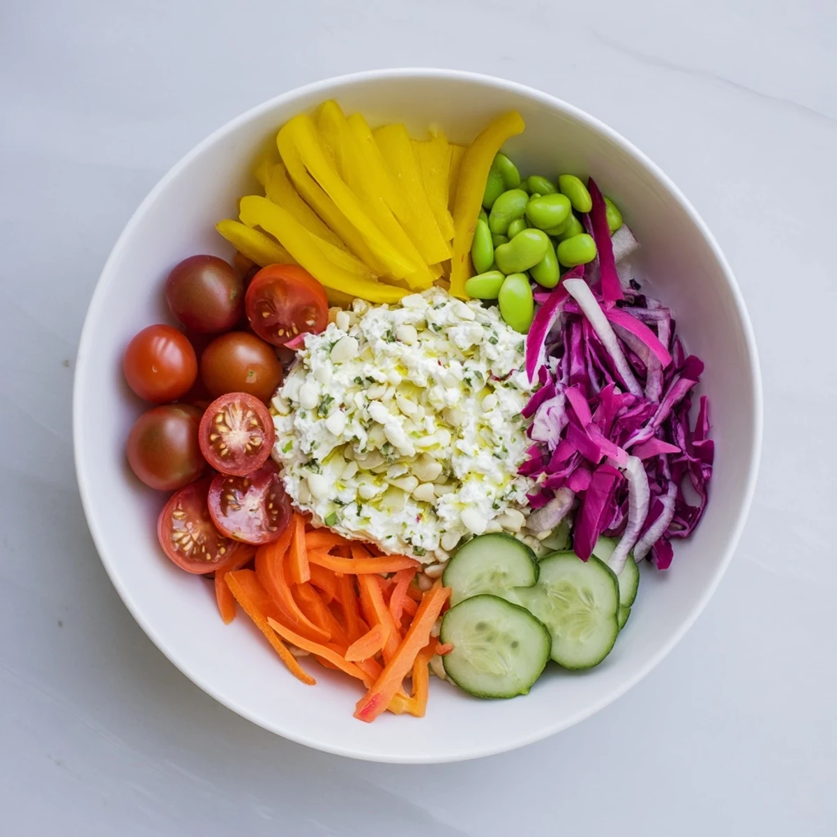 A beautiful plate of The Prism Burst Salad with vibrant fruit and vegetable stripes awaits.