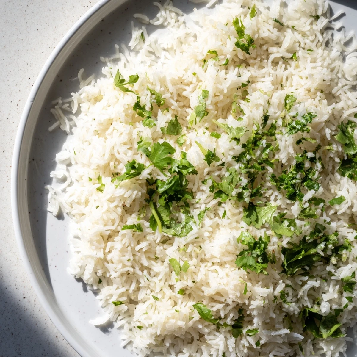 Steaming bowl of cilantro lime rice, perfectly cooked and bursting with fresh, zesty flavors.