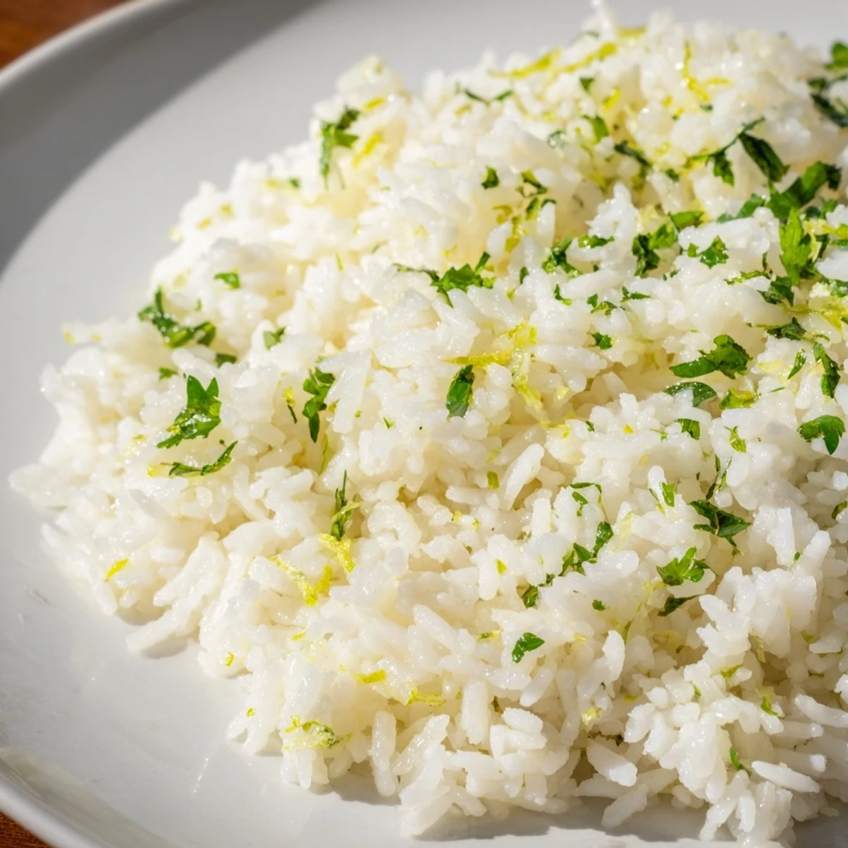 Fluffy cilantro lime rice, flecked with green cilantro, a bright, citrusy side for your meal.