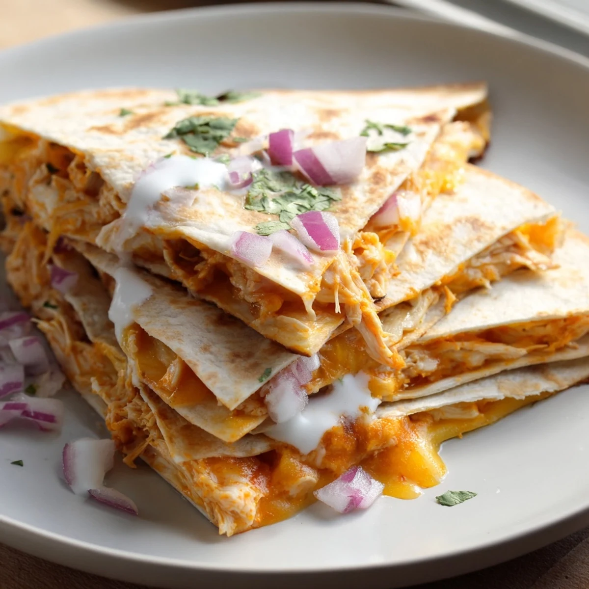 Melting cheese and tender buffalo chicken filling a crispy and delicious quesadilla.