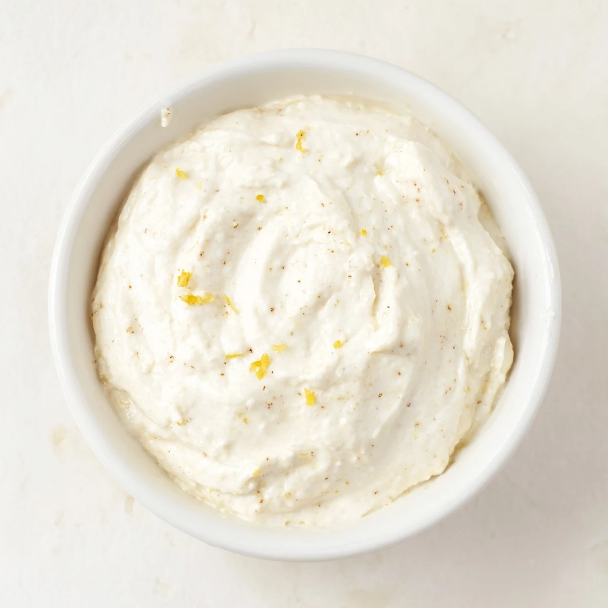 A close-up of a delightful Greek Yogurt Fruit Dip, perfectly chilled and ready for dipping juicy strawberries.