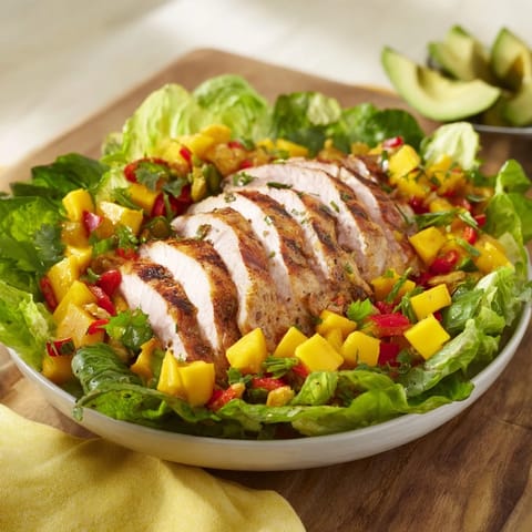 Vibrant image of Chicken and Mango Salsa Lettuce Wraps, showcasing fresh, colorful ingredients.