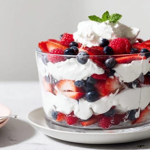 Magnificent Berry Parfait with a garnish of mint, creating a simply delicious, elegant dessert.