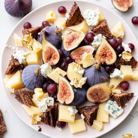 This Deep Indigo Midnight Sky appetizer features dark fruits and cheeses arranged on a wooden board.