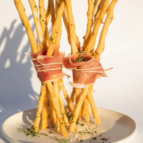 Appetizing photo: The Golden Gate, featuring thin prosciutto "bridge" connecting crispy breadsticks.