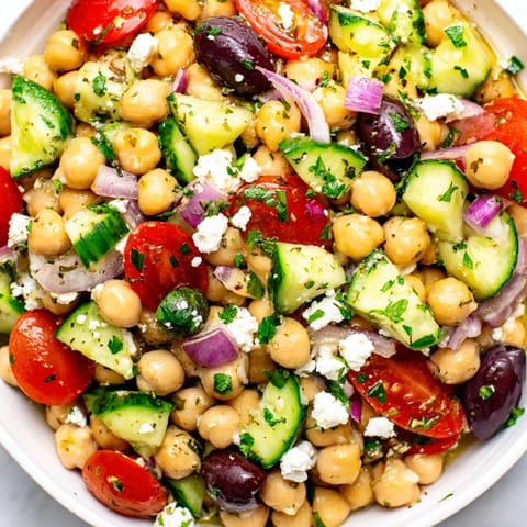 This Mediterranean Chickpea Salad features tender chickpeas, crunchy vegetables, and salty feta cheese.
