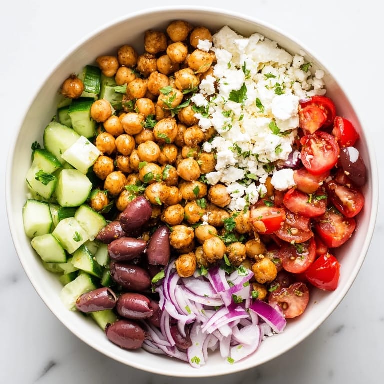 This Mediterranean Chickpea and Feta Bowl bursts with vibrant flavors, showcasing a healthy, quick lunch idea.