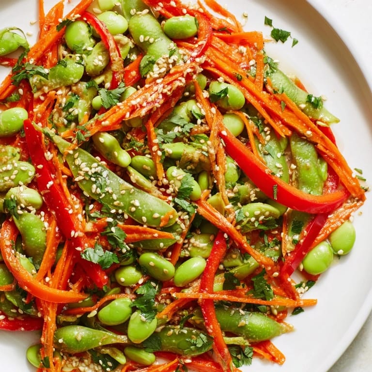 Close-up of a refreshing Asian edamame salad, sprinkled with sesame seeds, perfect for a quick lunch.