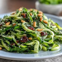 Fresh asparagus ribbons tossed with lemon zest and Parmesan, a bright spring salad bursting with flavor.  