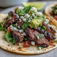 Cinco de Mayo Street Taco Bar featuring juicy carne asada and fresh toppings.